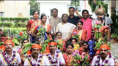 President-elect Droupadi Murmu interacts with folk performers at her temporary residence in New Delhi on Sunday. (HT PHOTO.) President-elect Droupadi Murmu interacts with folk performers at her temporary residence in New Delhi on Sunday. (HT PHOTO.)