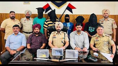 The men who were arrested while hatching a conspiracy to robbery in Ludhiana on Sunday. (HT Photo)
