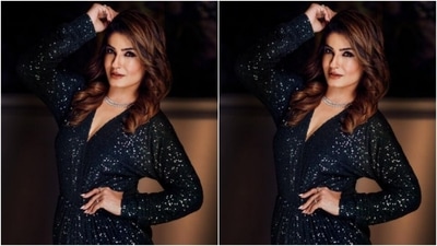 The gown featured sequin details in silver threads, a plunging neckline and one thigh high slit. In a diamond choker, Raveena aptly accessorised her look. (Instagram/@officialraveenatandon)