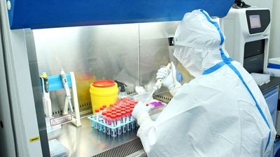  A laboratory technician working at a Covid-19 testing facility in Dingxi, in China's northwestern Gansu province. (AFP) A laboratory technician working at a Covid-19 testing facility in Dingxi, in China's northwestern Gansu province. (AFP)