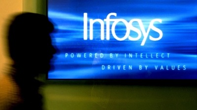 A man walks past a billboard of Infosys Technologies Ltd's office in Bangalore. (REUTERS)