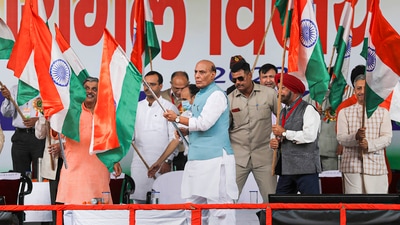 Defence minister Rajnath Singh waves the national flag during a programme commemorating Kargil Vijay Diwas in Jammu, Sunday. (PTI) Defence minister Rajnath Singh waves the national flag during a programme commemorating Kargil Vijay Diwas in Jammu, Sunday. (PTI)