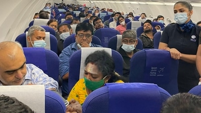 Telangana governor Tamilisai Soundararajan treating the co-passenger (twitter.com/iammrcn) Telangana governor Tamilisai Soundararajan treating the co-passenger (twitter.com/iammrcn)