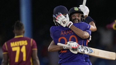 Axar Patel embraces Mohammed Siraj after win (AP)