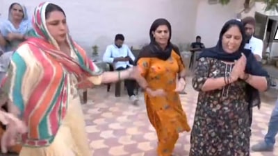 A video tweeted by news agency ANI showed women breaking into a dance to mark Chopra's landmark win. (ANI videograb) A video tweeted by news agency ANI showed women breaking into a dance to mark Chopra's landmark win. (ANI videograb)