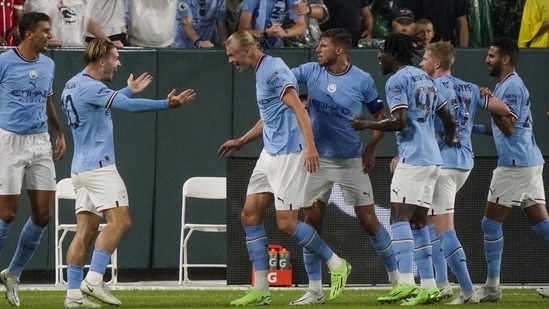 Manchester City's Jack Grealish and Erling Haaland celebrate after a goal against Bayern Munich(AP)