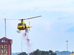A helicopter is used to shower flower petals on Kanwariyas. A helicopter is used to shower flower petals on Kanwariyas. 