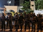 Sri Lanka protests: Air Force members stand guard in front of the Temple Trees Prime Minister Mahinda Rajapaksa's official residence during a protest, amid the country's economic crisis in Colombo.&nbsp;