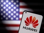 FILE PHOTO: Smartphone with a Huawei logo is seen in front of a U.S. flag in this illustration taken in 2021.