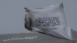 The Taliban flag is seen in a marketplace in Kabul, Afghanistan.