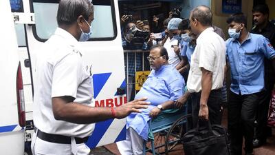 West Bengal minister Partha Chatterjee in a wheelchair while being shifted to AIIMS Bhubaneswar from SSKM hospital as per the order of the Calcutta High court, in Kolkata on Monday. (ANI PHOTO.) West Bengal minister Partha Chatterjee in a wheelchair while being shifted to AIIMS Bhubaneswar from SSKM hospital as per the order of the Calcutta High court, in Kolkata on Monday. (ANI PHOTO.)
