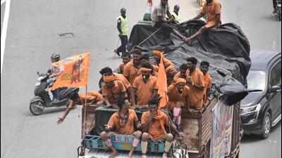 Kanwarias carrying holy water from Ganga river on the eve of Shivaratri on Delhi-Gurugram expressway on Monday. (Vipin Kumar/HT)