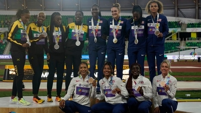 Teams USA, center, Jamaica, left, and Britain pose after the women's 4x400-meter relay at the World Athletics Championships (AP) Teams USA, center, Jamaica, left, and Britain pose after the women's 4x400-meter relay at the World Athletics Championships (AP)