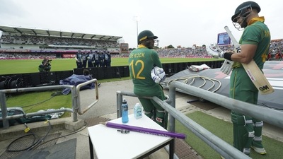 Quinton de Kock (centre) and Aiden Markram (right) wait for the game to restart after a rain delay against England in third ODI. (AP) Quinton de Kock (centre) and Aiden Markram (right) wait for the game to restart after a rain delay against England in third ODI. (AP)