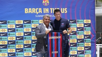 FC Barcelona soccer team President Joan Laporta, left, introduces new striker Robert Lewandowski (AP) FC Barcelona soccer team President Joan Laporta, left, introduces new striker Robert Lewandowski (AP)