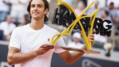 Italy's Lorenzo Musetti holds the trophy after beating Spain's Carlos Alcaraz, at the Hamburg tennis tournament, Germany (AP) Italy's Lorenzo Musetti holds the trophy after beating Spain's Carlos Alcaraz, at the Hamburg tennis tournament, Germany (AP)