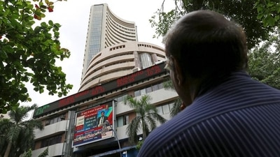A man looks at a screen across a road displaying the Sensex on the facade of the Bombay Stock Exchange (BSE) building in Mumbai, India. (File image) (REUTERS)