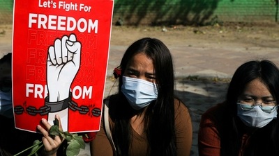 Myanmar citizens living in India hold a placard as they attend a protest, organised by pro-democracy supporters, against the military coup in Myanmar and demanding recognition of the National Unity Government of Myanmar, in New Delhi, India, February 22, 2022. REUTERS/Anushree Fadnavis/File Photo