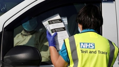 A National Health Service employee on duty A National Health Service employee on duty