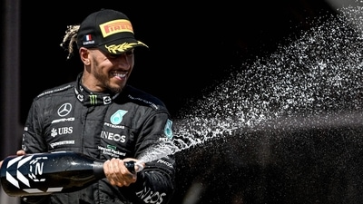 Second placed Mercedes' British driver Lewis Hamilton celebrates with champagne on the podium of the French Formula One Grand Prix. (AFP) Second placed Mercedes' British driver Lewis Hamilton celebrates with champagne on the podium of the French Formula One Grand Prix. (AFP)