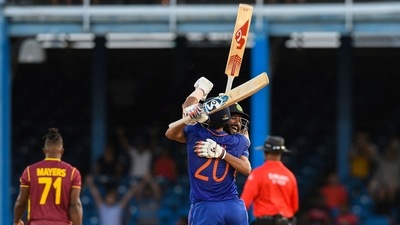 Axar Patel and Mohammed Siraj celebrate winning the 2nd ODI match between West Indies and India at Queens Park Oval, Port of Spain. (AFP) Axar Patel and Mohammed Siraj celebrate winning the 2nd ODI match between West Indies and India at Queens Park Oval, Port of Spain. (AFP)