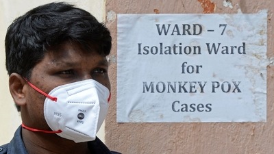 A security guard stands at the entrance of an isolation ward for monkeypox patients at a government hospital in Hyderabad on July 25, 2022. (AFP)