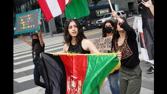 Afghan Americans at a rally against the Taliban and developments in Afghanistan during a demonstration in downtown Los Angeles, California, U.S. on August 21, 2021. (REUTERS)