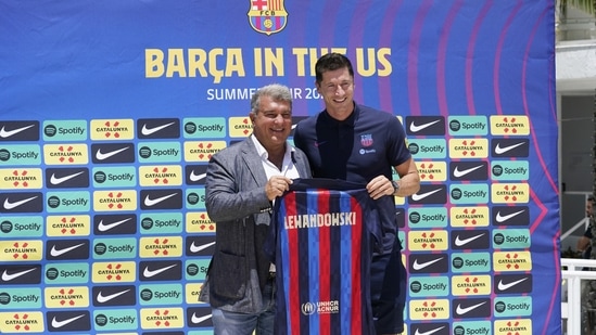 FC Barcelona soccer team President Joan Laporta, left, introduces new striker Robert Lewandowski(AP) FC Barcelona soccer team President Joan Laporta, left, introduces new striker Robert Lewandowski(AP)