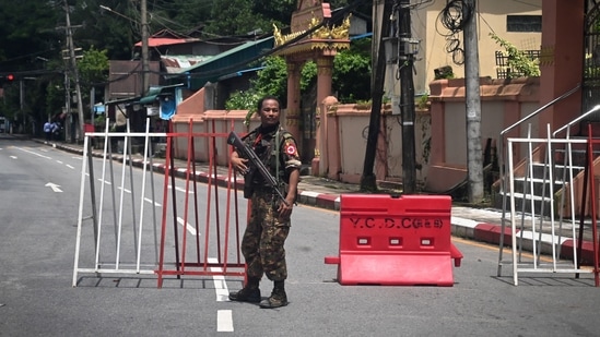 A member of the Myanmar security forces stands by a checkpoint in Yangon on on the 75th Martyrs' Day that marks the anniversary of the assassination of independence leaders including general Aung San, father of the currently deposed and imprisoned leader Aung San Suu Kyi. (AFP) A member of the Myanmar security forces stands by a checkpoint in Yangon on on the 75th Martyrs' Day that marks the anniversary of the assassination of independence leaders including general Aung San, father of the currently deposed and imprisoned leader Aung San Suu Kyi. (AFP)