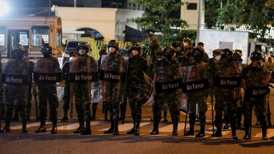 Sri Lanka protests: Air Force members stand guard in front of the Temple Trees Prime Minister Mahinda Rajapaksa's official residence during a protest, amid the country's economic crisis in Colombo.&nbsp;(REUTERS)