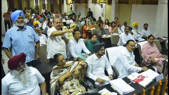 Councillors interacting with mayor Balkar Sandhu and MC commissioner Shena Aggarwal during the House meeting at the civic body’s Zone-A office on Monday. (Gurpreet Singh/HT)