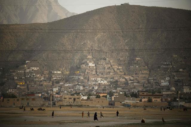 Children play football at the now dry Hashmat Khan Lake in Kabul on July 20, 2022. (AFP) Children play football at the now dry Hashmat Khan Lake in Kabul on July 20, 2022. (AFP)