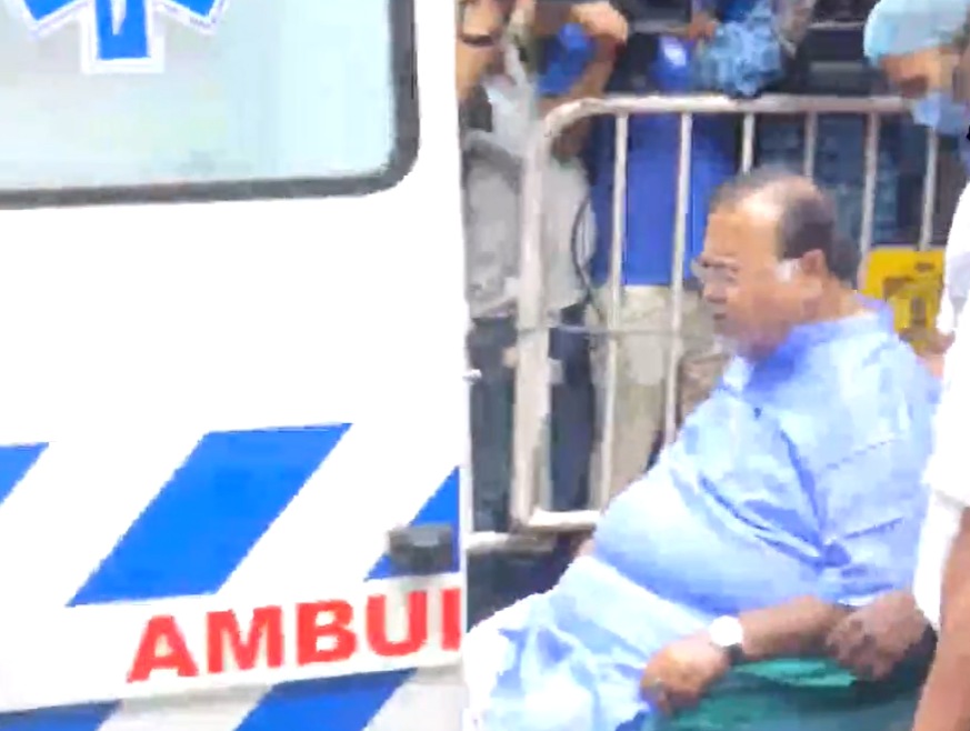Bengal minister Partha Chatterjee being brought out of SSKM Hospital in Kolkata on Monday. (ANI Twitter)
