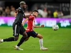 Juventus' Paul Pogba, left, and Chivas' Pavel Perez battle for the ball Juventus' Paul Pogba, left, and Chivas' Pavel Perez battle for the ball