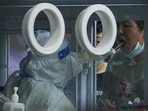 Residents line up to get their routine throat swab at a Covid-19 testing site in Beijing. Residents line up to get their routine throat swab at a Covid-19 testing site in Beijing.