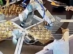 A chess-playing robot grabbed the finger of its 7-year-old opponent and broke it(Screengrab) A chess-playing robot grabbed the finger of its 7-year-old opponent and broke it(Screengrab)