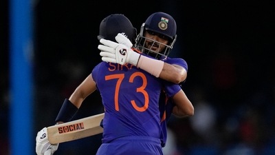 India's Axar Patel&nbsp;celebrates with teammate Mohammed Siraj&nbsp;after hitting a six to win the second ODI cricket match against West Indies at Queen's Park Oval in Port of Spain, Trinidad and Tobago (AP)