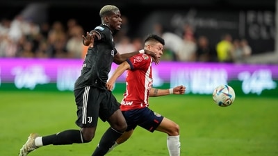 Juventus' Paul Pogba, left, and Chivas' Pavel Perez battle for the ball (AP)