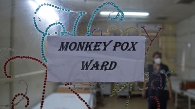 TOPSHOT - A health worker walks inside an isolation ward built as a precautionary measure for the monkeypox patients at a civil hospital in Ahmedabad on July 25, 2022. (AFP) TOPSHOT - A health worker walks inside an isolation ward built as a precautionary measure for the monkeypox patients at a civil hospital in Ahmedabad on July 25, 2022. (AFP)