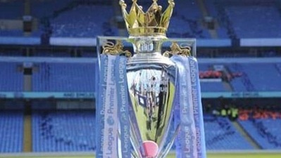The Premier League trophy sits on the pitch. (AP) The Premier League trophy sits on the pitch. (AP)