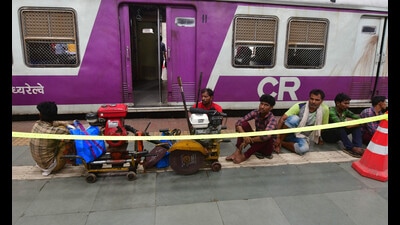 Restoration work underway after one trolley of the coach of a Panvel-bound local train derailed in the morning when it moved in the reverse direction and touched the dead-end of Platform No. 1 at CSMT, affecting services on the Harbour Line but no one was injured. (Bhushan Koyande/HT Photo)