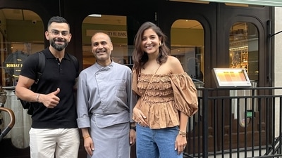 Anushka Sharma and Virat Kohli posing with a chef in London.