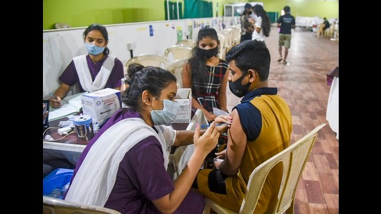 A beneficiary receiving a dose of Covid-19 vaccine. (HT FILE PHOTO)