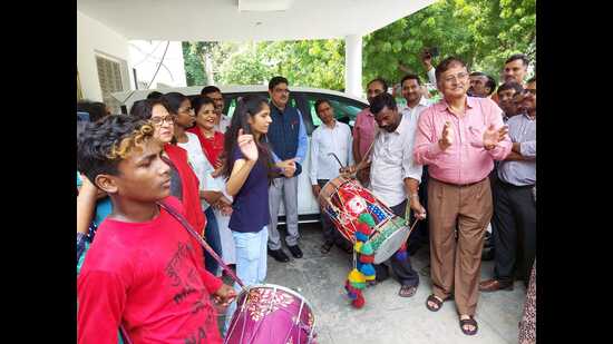 A big celebration under way outside the Lucknow University vice chancellor’s office where teachers and students danced to beat of “dhol” (drum). (HT photo) A big celebration under way outside the Lucknow University vice chancellor’s office where teachers and students danced to beat of “dhol” (drum). (HT photo)