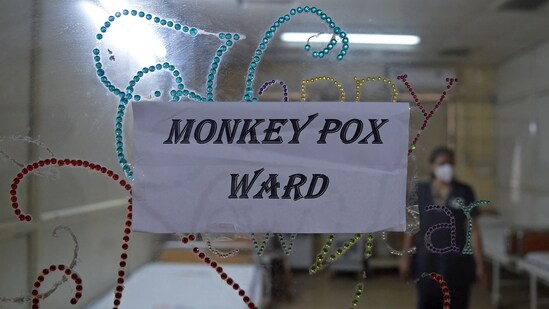 TOPSHOT - A health worker walks inside an isolation ward built as a precautionary measure for the monkeypox patients at a civil hospital in Ahmedabad on July 25, 2022.(AFP)