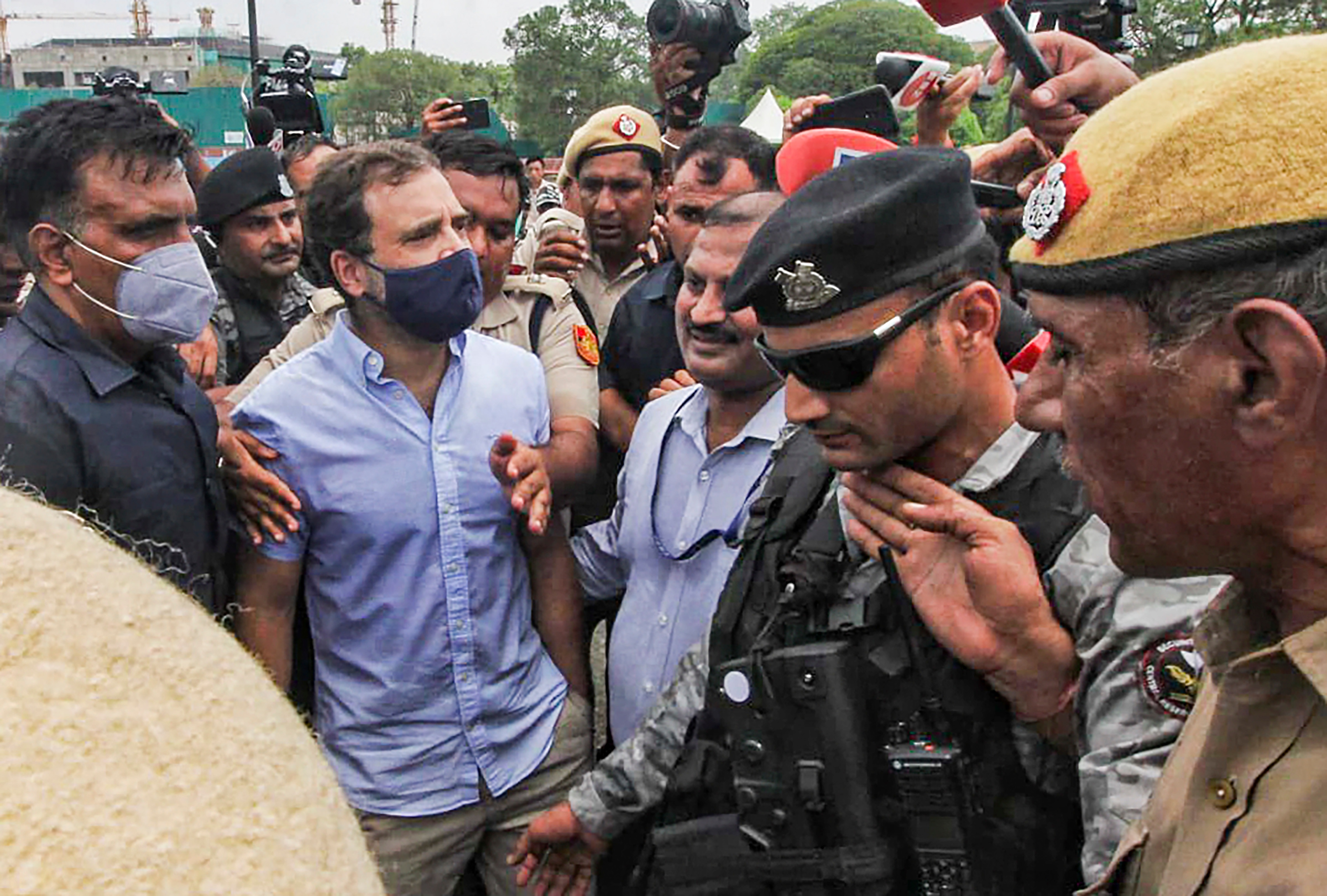 Congress MP and former president Rahul Gandhi being detained by police during party MPs' march to Rashtrapati Bhavan. (PTI)