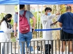 Healthcare workers with New York City Department of Health and Mental Hygiene help people register for the monkeypox vaccine. Healthcare workers with New York City Department of Health and Mental Hygiene help people register for the monkeypox vaccine.