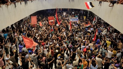 Supporters of Iraqi Shi'ite cleric Moqtada al-Sadr protest against corruption inside the parliament building in Baghdad, Iraq. (REUTERS)