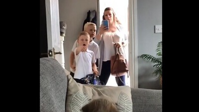 The image, taken from the Reddit video, shows the kids looking at the dog. (Reddit/@frosted_bite)