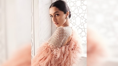 Shraddha Kapoor kept her hair simple and tied a low, middle-parted bun. Since her outfit was already on the heavy side, Shraddha decided to team her look with small stone stud earrings and wore minimal makeup with winged eyes. (Instagram/@shraddhakapoor) Shraddha Kapoor kept her hair simple and tied a low, middle-parted bun. Since her outfit was already on the heavy side, Shraddha decided to team her look with small stone stud earrings and wore minimal makeup with winged eyes. (Instagram/@shraddhakapoor)